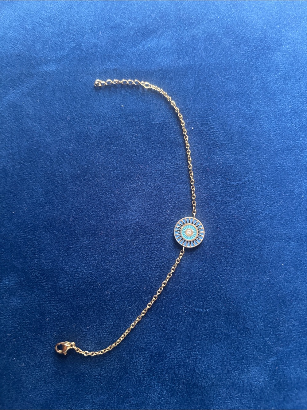 Gold Tone Bracelet with Blue Enamel Sunburst Charm